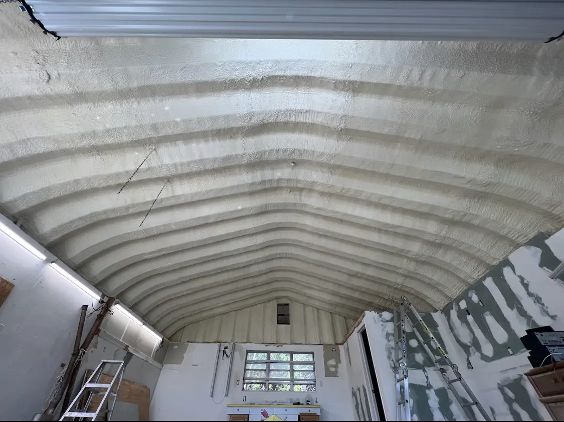 Spray polyurethane foam applied to the underside of a metal roof deck in Hobart